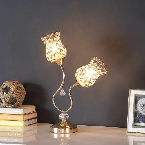 Rose gold metal floral table lamp with acrylic bead accents